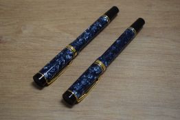 Two Parker Duofold rollerball pens in blue. No cartridge