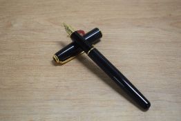 A Parker Sonnet converter fill fountain pen in Laque Black having Parker 18k 750 nib