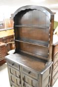 A vintage Priory style dark stained Dutch dresser, width approx. 92cm