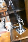 A reproduction angle poise lamp, in chrome finish