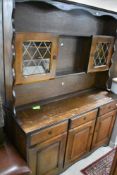 A reproduction oak effect dresser