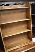 A stained frame Priory style low bookshelf, width approx. 63cm