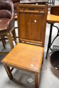 A traditional golden oak Gothic Ecclesiastical style hall chair , with inscription plaque to Frank