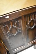 A traditional gothic style oak panel, possibly bed head, width approx. 100cm