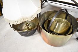 A selection of vintage brass pans etc