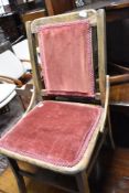 A stained frame dining chair having upholstered seat