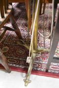An Art Nouveau brass double standard lamp