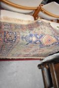 An Oriental silk based rug, approx. 117 x 70cm