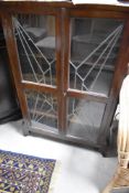 An Art Deco style oak bookcase of slim design approx dimensions W66 D20 H110cm