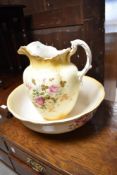 A late 19th or early 20th Century jug and bowl set with transfer print design