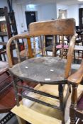 A 19th Century oak captains chair having turned frame