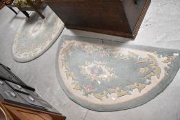 Two modern chinese rugs, half moon and fireside style , having green ground