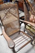 Two early 20th Century bergere backed armchairs