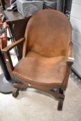 A early 20th Century oak low armchair