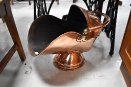 An antique copper coal helmet