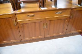 A vintage teak sideboard, of stylised form, possibly G plan Fresco, width approx 185cm