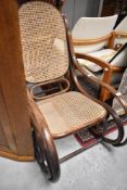 A bentwood and canework rocking chair