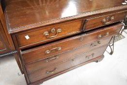 A 19th Century Georgian style mahogany chest of two over three drawers having drop handles and