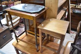 Two occasional tables and a frameless mirror