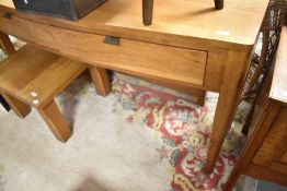 A modern golden oak console table having bow front and two frieze drawers, width approx. 147cm