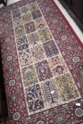 A vintage carpet square and similar fireside rug