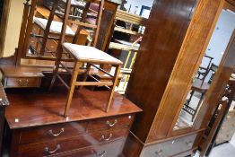 An Edwardian mahogany and inlaid bedroom suite comprising wardrobe, dressing table, three bedroom