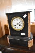 A Victorian black and rouge marble mantel clock , having enamelled face with Roman numeral dial