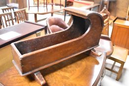 A 19th Century oak dolls or specimen cot, length approx. 45cm