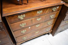 A 19th Century Georgian design chest of drawers having four long drawers, with brass drop handles