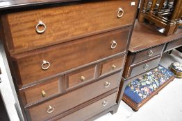 A Stag dressing table and similar multi drawer bedroom chest