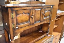 A Titchmarsh and Goodwin or similar nice quality reproduction oak side cabinet, width approx. 107cm
