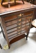 An Art Nouveau mahogany music cabinet, height approx. 79cm