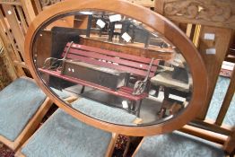 A light mahogany oval wall mirror, width approx. 81cm