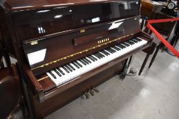 A modern upright piano, Yamaha model P116N, serial number E250800