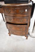A reproduction walnut dwarf chest of four drawers (top single drawer is faux pair) , width approx.