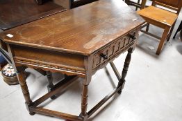 A Priory style hall or side table with additional drop flap to rear