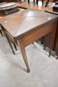 A late Victorian oak envelope games table, top loose, width approx. 56cm