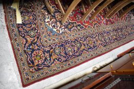 A vintage carpet square having red ground, approx. 295 x 200cm