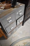 A vintage metal six drawer index chest