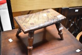 An Antique stool of small proportions having four splay turned legs, approx. 27 x 14cm