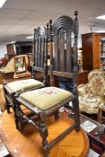 A pair of 19th Century dark stained dining chairs having rail back with demi lune shoulders,