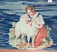 A Victorian rosewood framed woolwork embroidery, depicting a young girl and sheep, within a gilt