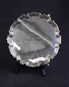 A George VI silver salver, of circular form having a Chippendale style rim, with a central