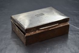 A 20th century silver cigarette box, of hinged rectangular form having engine turned decoration to