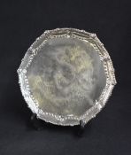 A Victorian silver salver, of circular form having a bead and scroll rim with floral motif swags