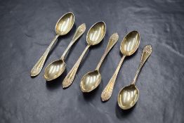A cased set of six George V silver Hanoverian style teaspoons, having embossed decoration to the