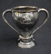 A George V silver Arts & Crafts style trophy, of traditional form having a slightly flared rim,