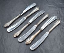 A cased set of six George V silver handled knives, having embossed decoration to the handles and