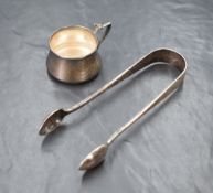 A pair of Victorian silver sugar tongs, of plain traditional form with 'JMF' monogram to the end,