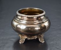 A Victorian silver sugar bowl, of a bulbous form having a decorative moulded rim and step moulded to